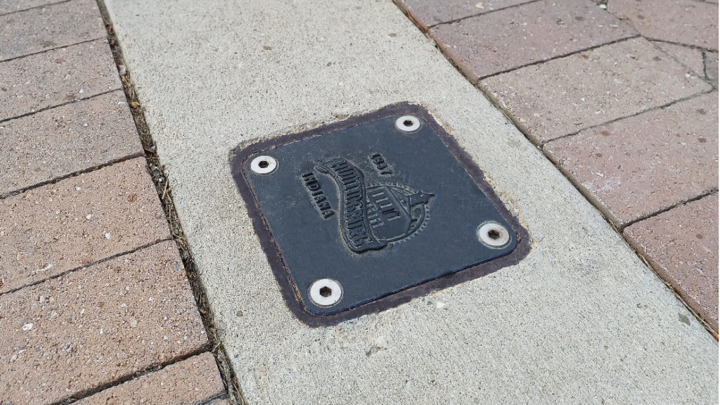 Custom-stamped bollard mount cap in Huntingburg, Indiana.